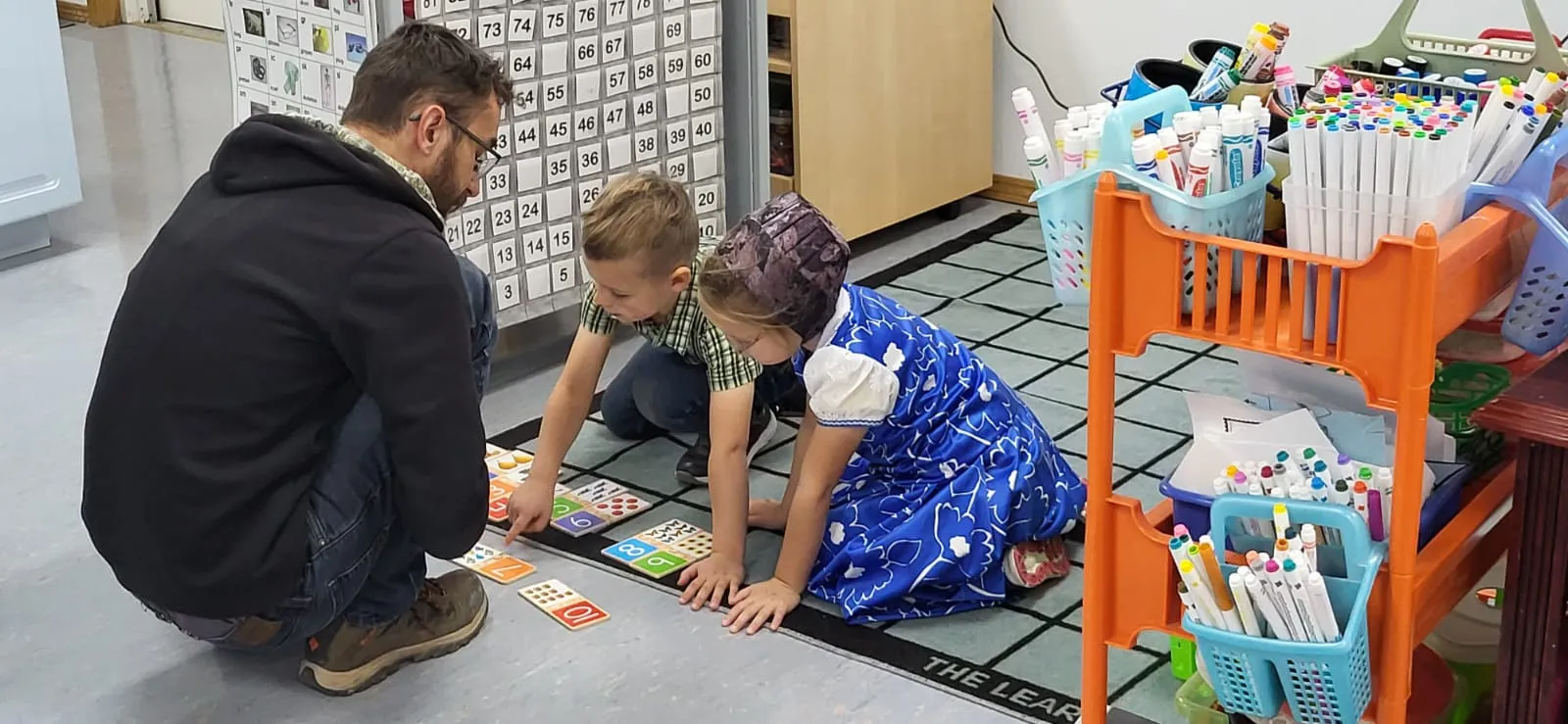 Working on a math problem with kindergartens