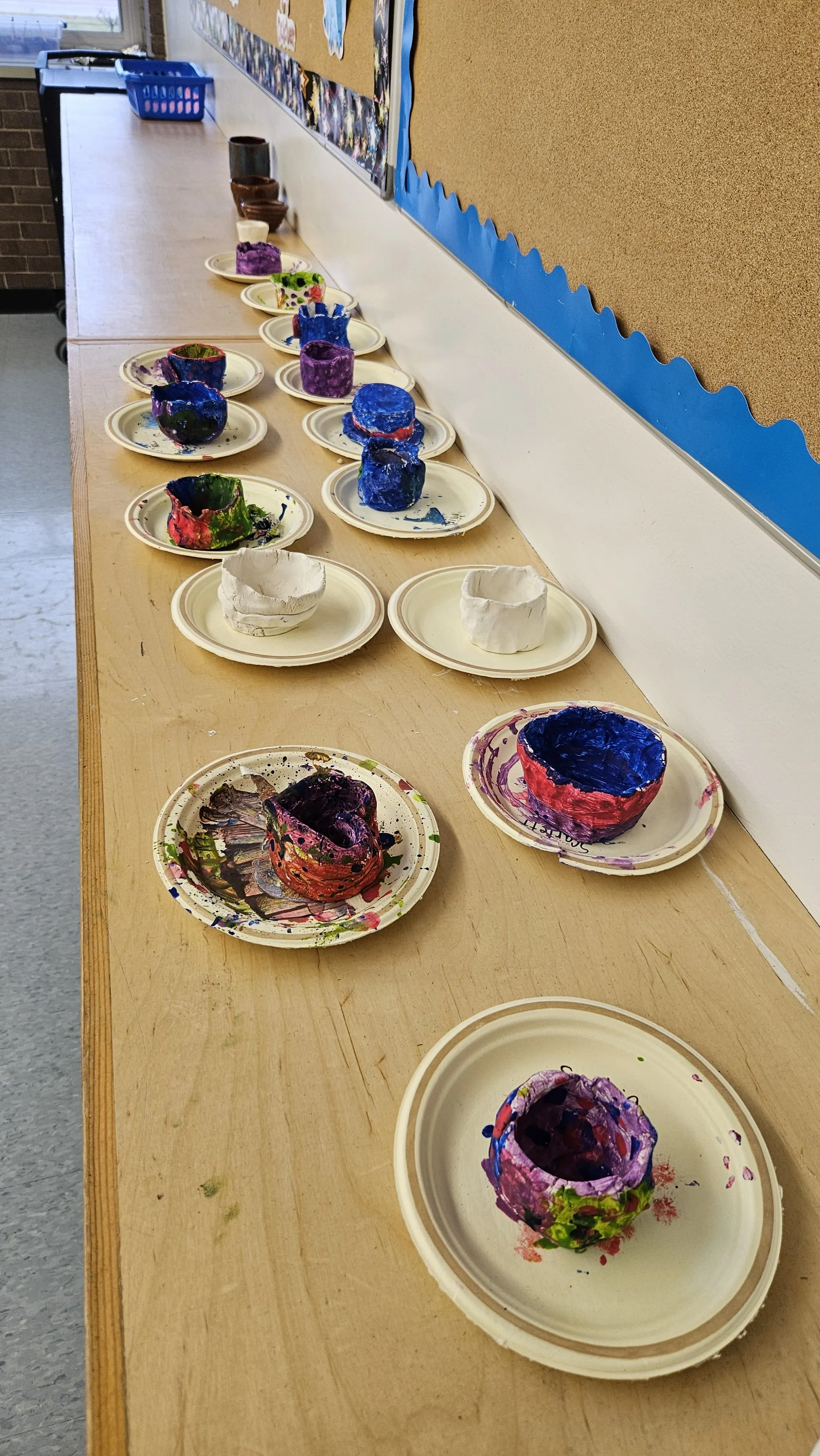 Student pottery and planted seedlings